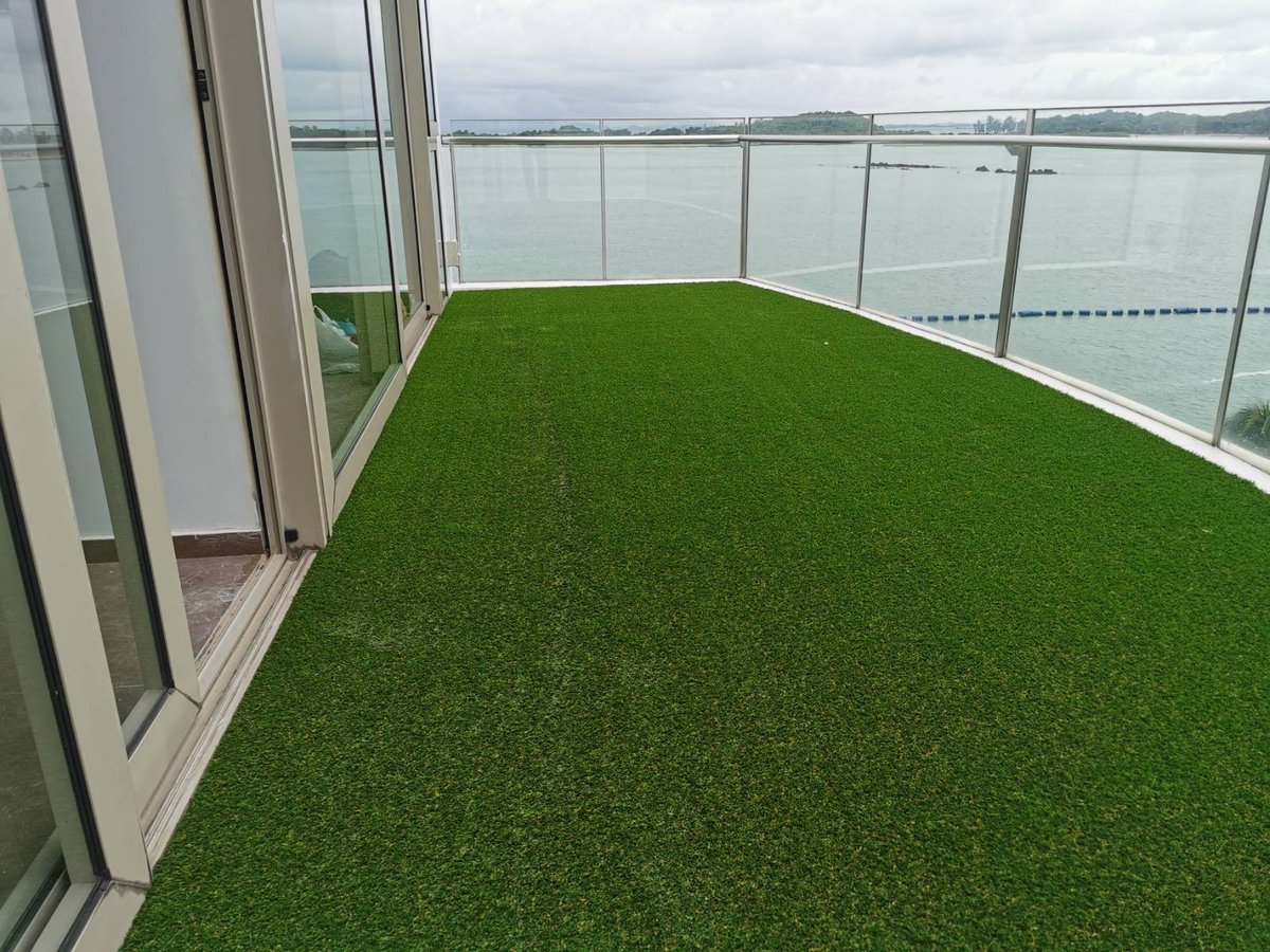 Bleu @ East Coast condo balcony after, lush wall-to-wall artificial grass