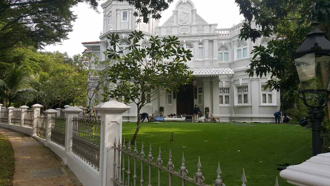 Namgrass artificial grass being laid wall-to-wall across the heritage bungalow front lawn