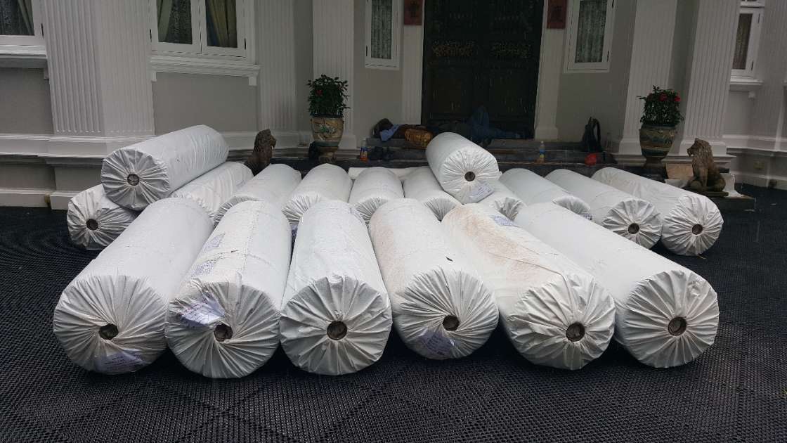 Rolls of premium Namgrass artificial grass delivered to the heritage bungalow