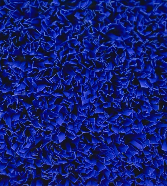 Close-up of blue Namsports Padel PE artificial grass, showing the fibrillated fibres from above