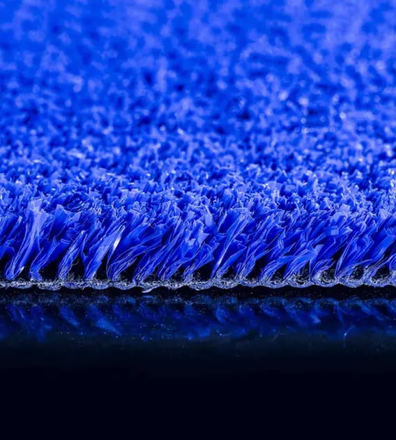 Side profile of blue Namsports Padel PE artificial grass, showing the 14 mm pile height and backing