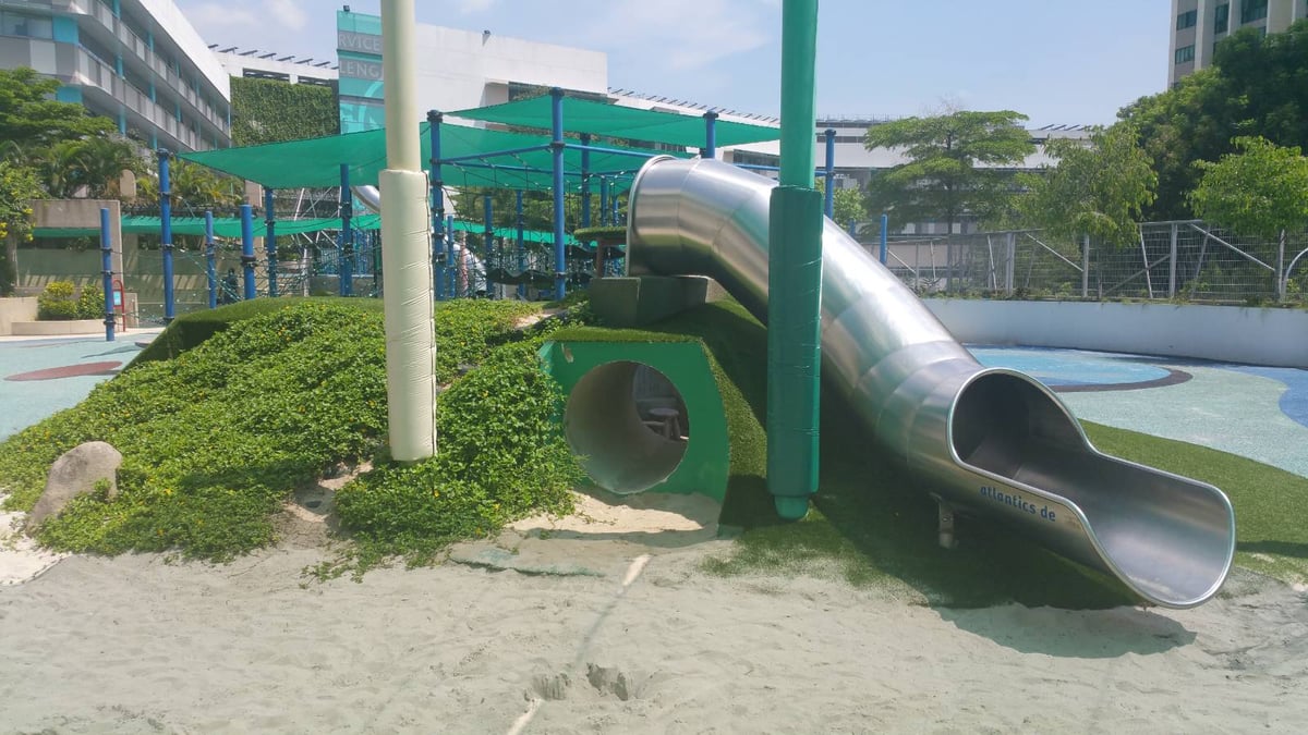 Artificial grass play mound with tunnel at United World College, Singapore