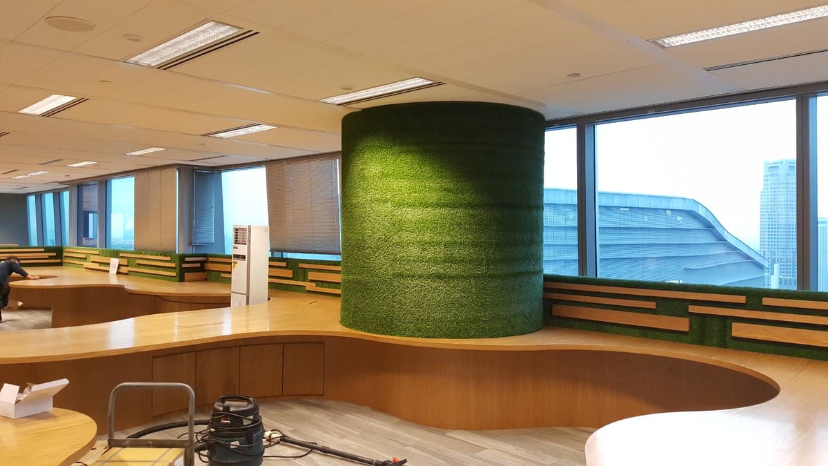 Grass-wrapped feature column and window-sill turf in an office at Capital Tower, Singapore