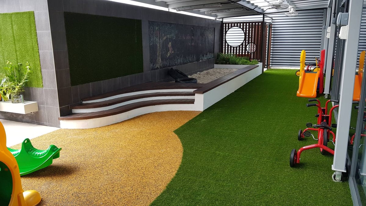 Artificial grass playground with slide and tunnel at Junction 10, Singapore