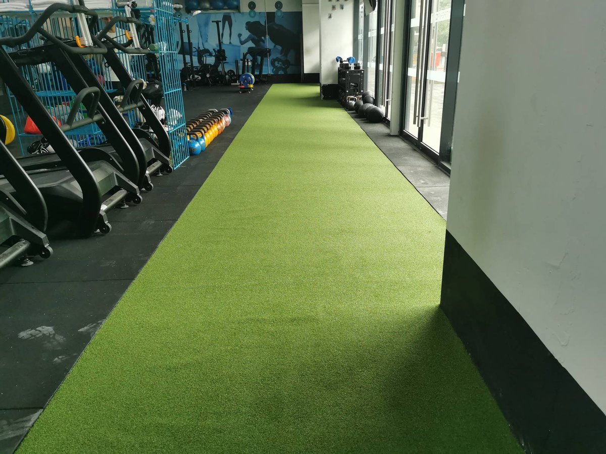 Artificial grass gym floor with kettlebells and plyo boxes at BFT Tai Seng, Singapore