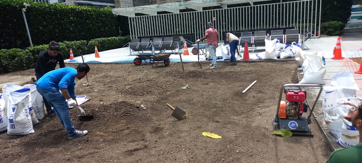 The ibuild team levelling and preparing the base surface at One Shenton