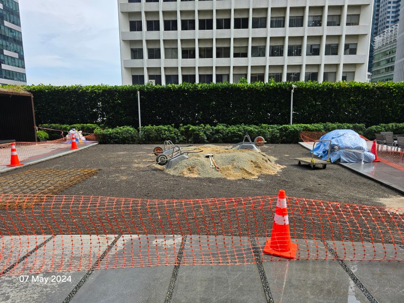 Sand and cement staged on the One Shenton rooftop deck, ready for screeding, 07 May 2024