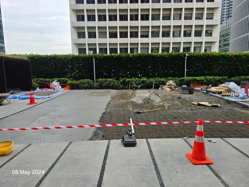 Steel mesh reinforcement and cement screed being laid at One Shenton, 08 May 2024
