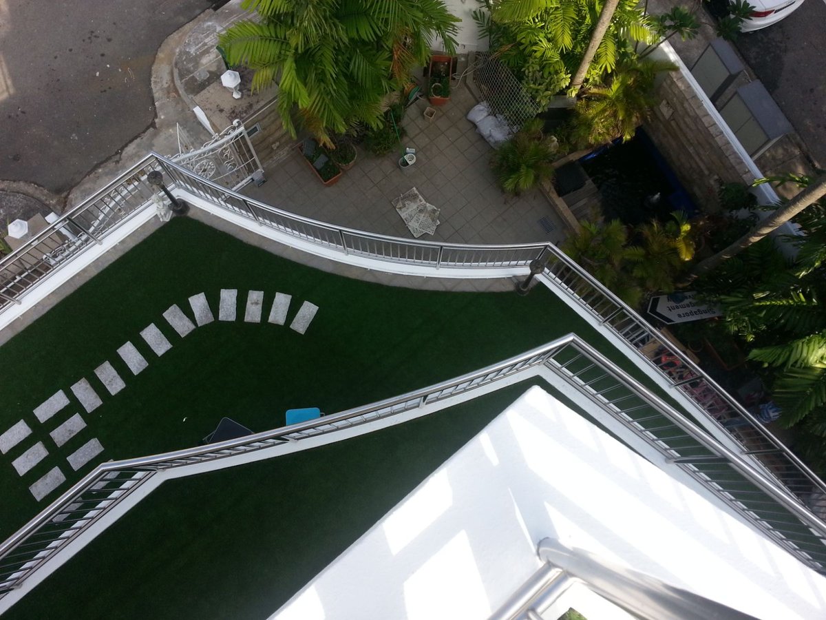Synthetic grass laid around an outdoor jacuzzi on the Da Silva Lane roof terrace